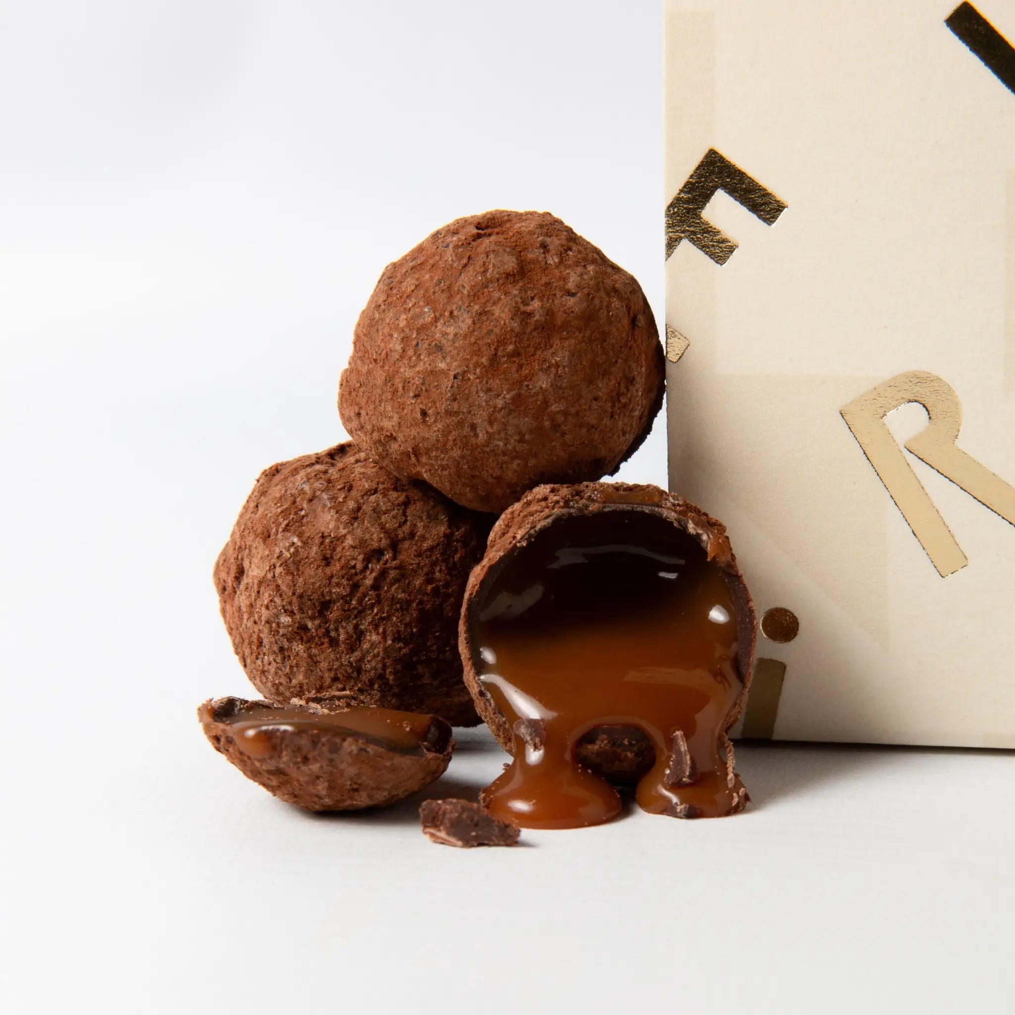 Close-up of luxury chocolate salted butter caramels with rich, flowing caramel centres, handmade by The Chocolatier and available at Tea Lab Pantry