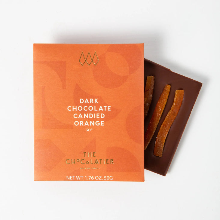 Dark chocolate candied orange bar by The Chocolatier – rich single-origin dark chocolate with strips of candied orange, available at Tea Lab.