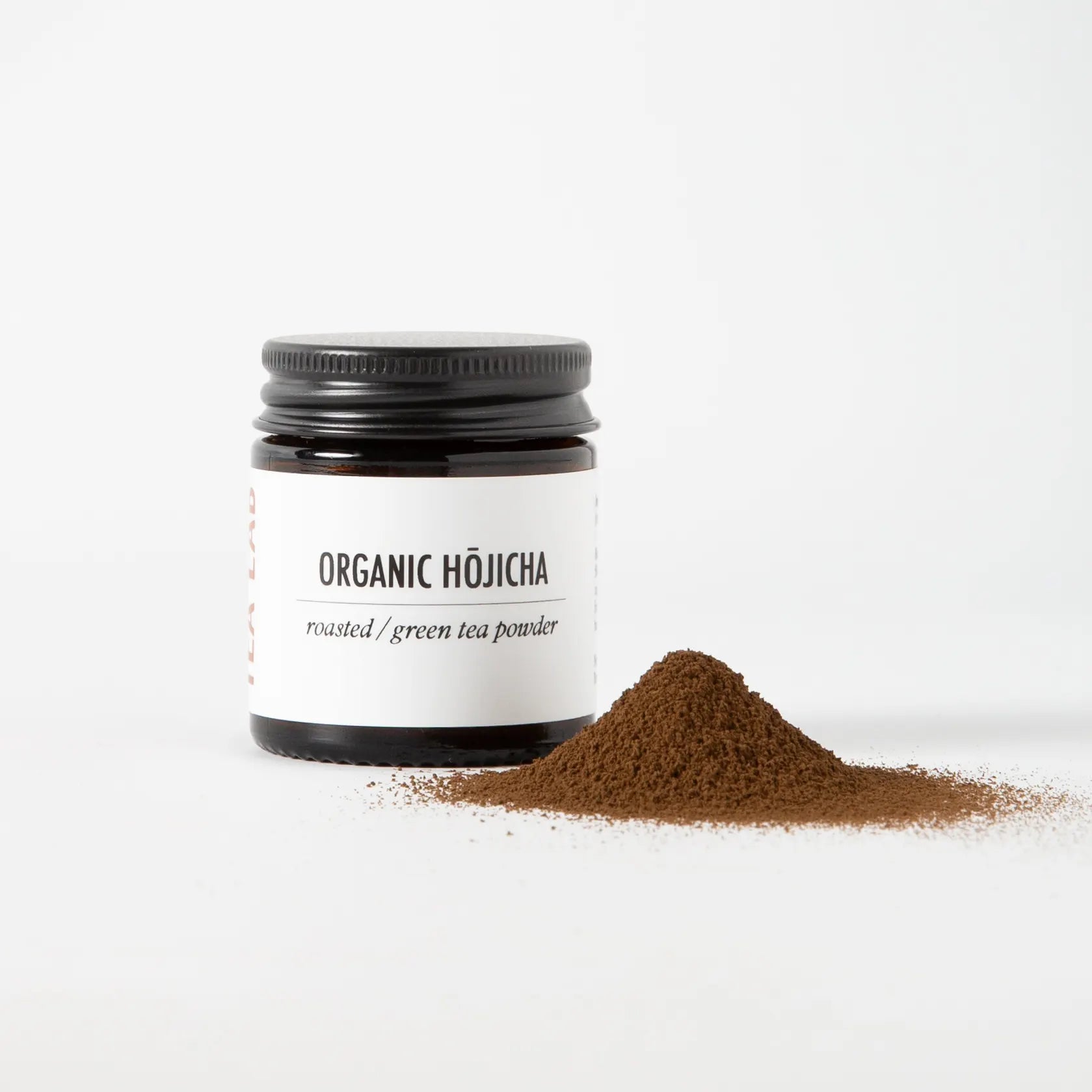 Jar of Tea Lab Organic Hōjicha roasted green tea powder with minimalist label, featuring earthy brown tones and smooth, caramelised aroma — authentic Japanese tea handcrafted for modern tea rituals.