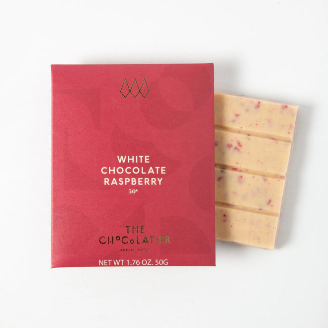 White chocolate raspberry bar by The Chocolatier – creamy white chocolate blended with raspberry pieces, available from Tea Lab