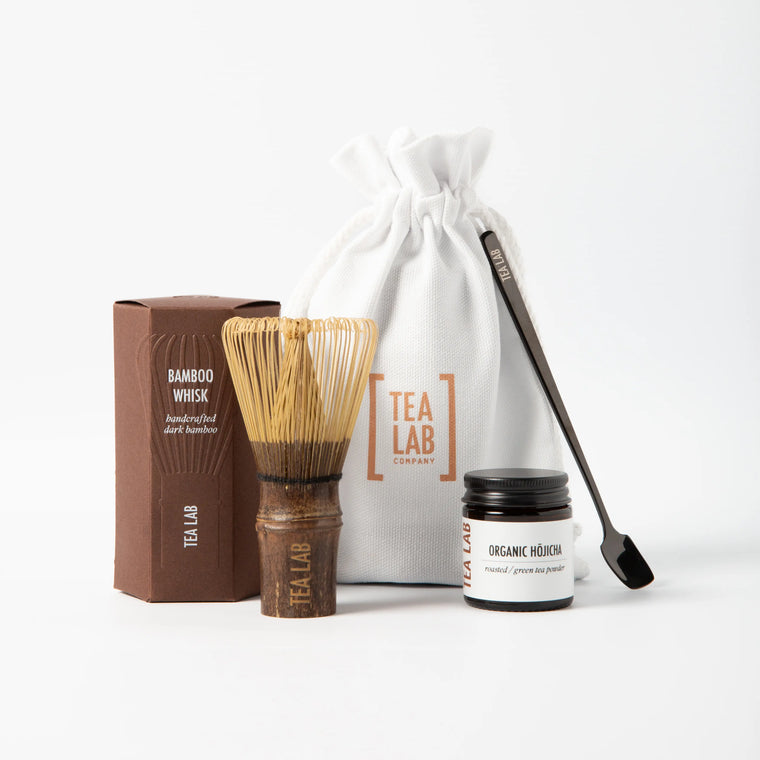 Organic hojicha starter kit with bamboo whisk and measured scoop in a cotton branded pouch