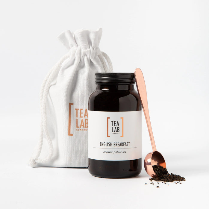 Glass jar of loose leaf tea gift set with copper scoop