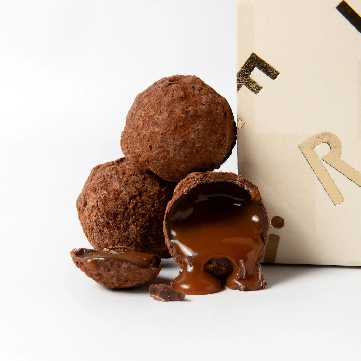 Close-up of luxury chocolate salted butter caramels with rich, flowing caramel centres, handmade by The Chocolatier and available at Tea Lab Pantry