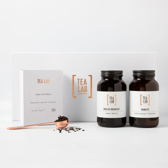 Tea Lab two-jar loose leaf tea gift set with English Breakfast and spearmint tea blends, eco-friendly tea filters, and copper tea scoop – premium tea gift for tea lovers.